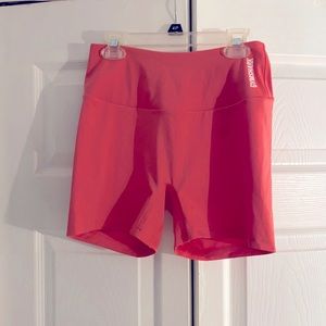 Gym Shark training shorts in Sunset Pink
